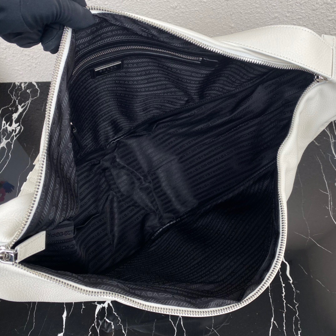 large leather Pra*a triangle bag