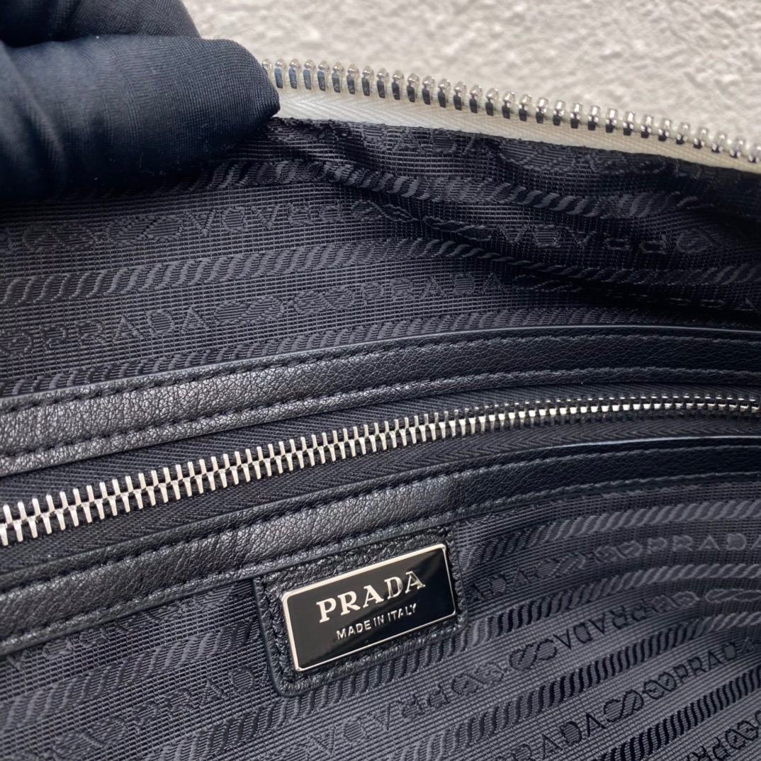 large leather Pra*a triangle bag