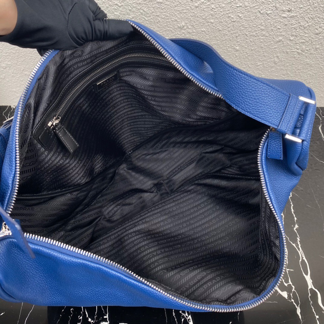 large leather Pra*a triangle bag