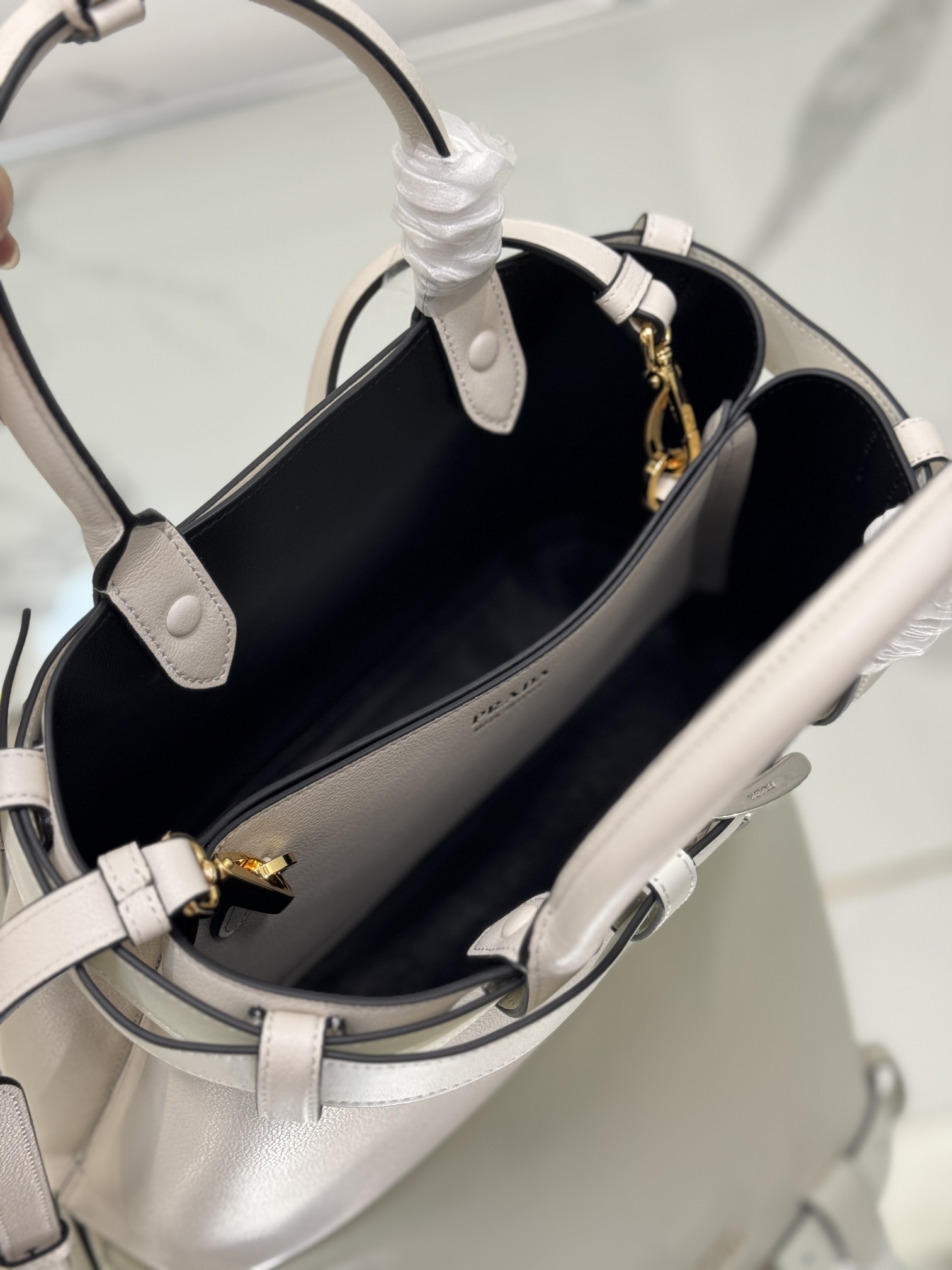 Pra*a buckle medium leather handbag with belt